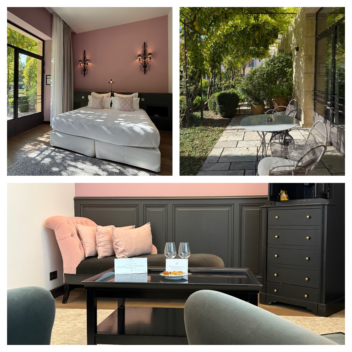 A three-image collage shows different areas of an accommodation. The top left displays a bedroom with a white bed against a dusty pink accent wall, decorative wall sconces, and large windows overlooking greenery. The top right shows a private outdoor patio with a round metal table and chairs on stone pavers, surrounded by mature trees and hedges. The bottom image features a sitting area with a pink velvet sofa against dark paneled walls, a black coffee table with wine glasses and snacks, and a matching dark wood chest of drawers.