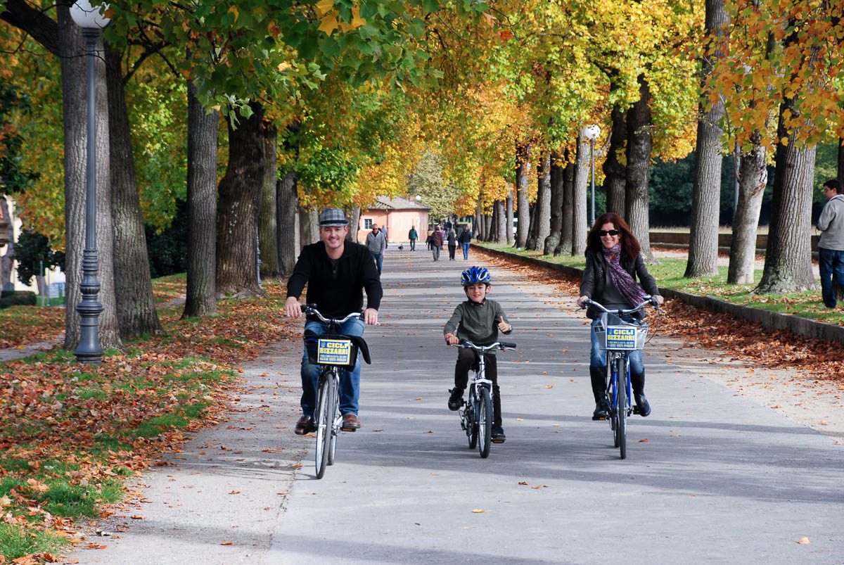 family bike ride on the walls of lucca, italy